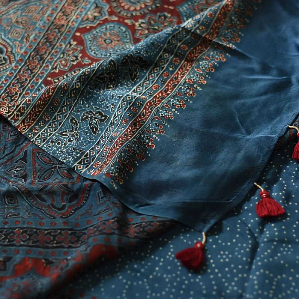 deep indigo blue madder red ajrakh modal silk saree hand block printed octagonal star jaal ornate floral mandala pallu traditional ethnic wear sustainable luxury natural dyed with tassels