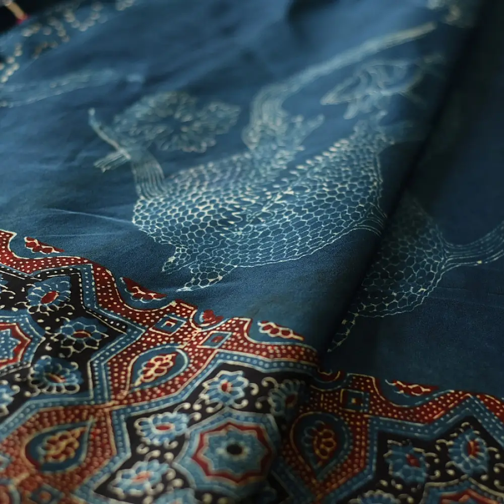 deep indigo blue madder red ajrakh modal silk saree hand block printed octagonal star jaal ornate floral mandala pallu traditional ethnic wear sustainable luxury natural dyed with tassels