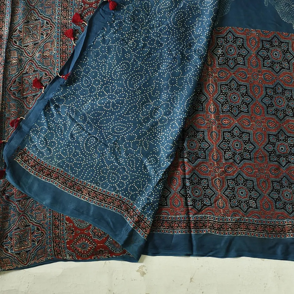 deep indigo blue madder red ajrakh modal silk saree hand block printed octagonal star jaal ornate floral mandala pallu traditional ethnic wear sustainable luxury natural dyed with tassels