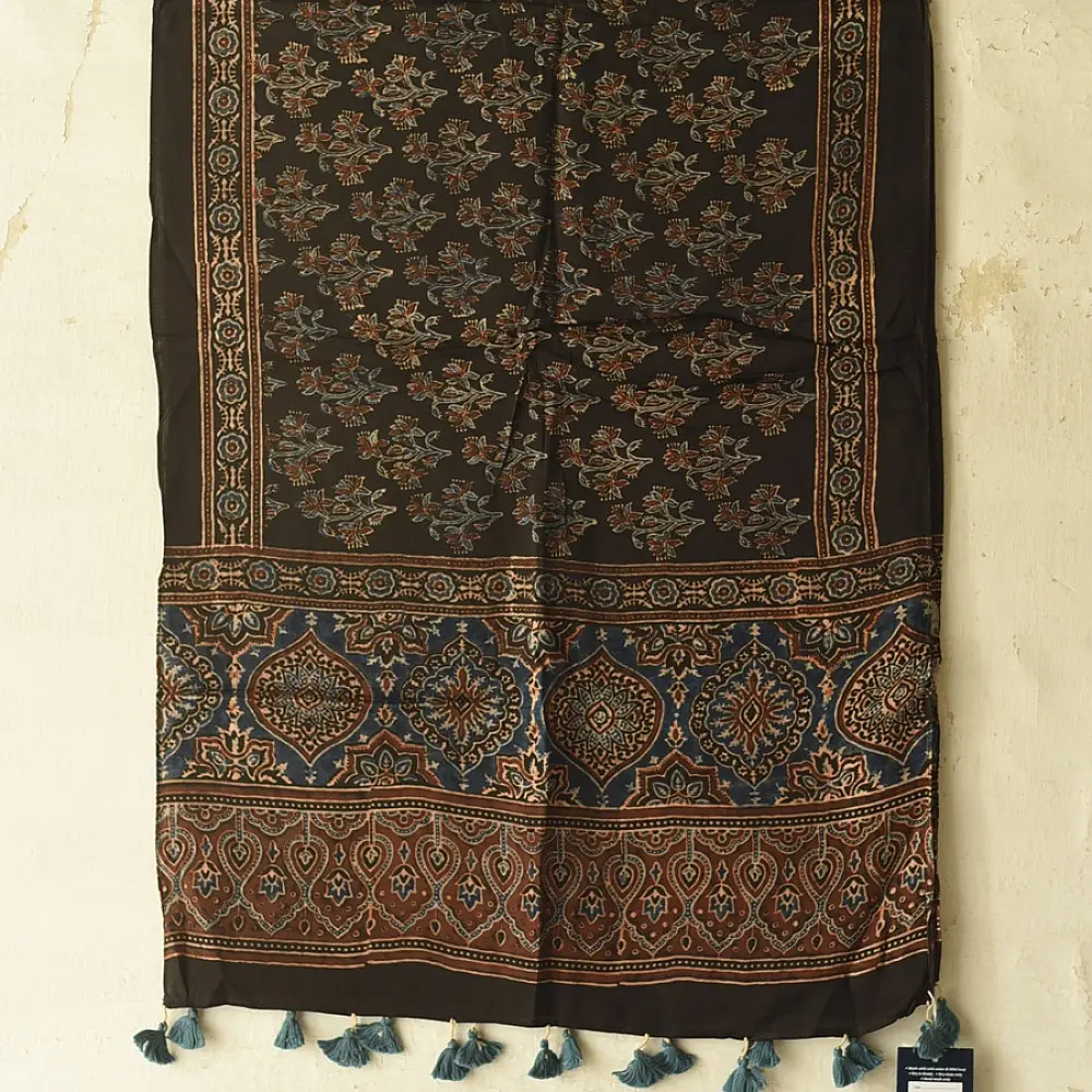 chocolate brown indigo blue ajrakh modal silk dupatta hand block printed jhar floral sprig jaal body ornate circular medallion pallu traditional mihrab arched detail wedding festive wear sustainable luxury natural dyed with tassels