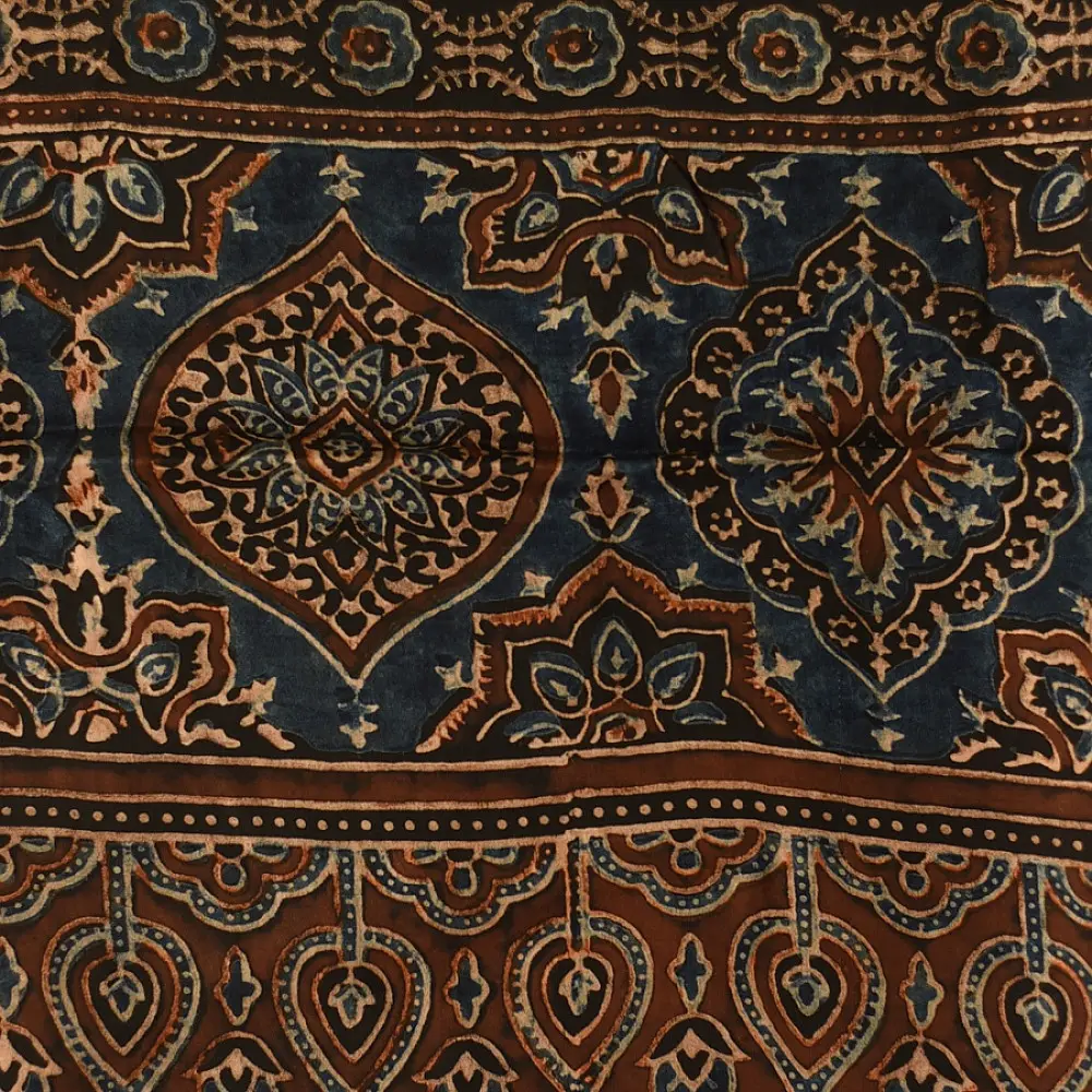 chocolate brown indigo blue ajrakh modal silk dupatta hand block printed jhar floral sprig jaal body ornate circular medallion pallu traditional mihrab arched detail wedding festive wear sustainable luxury natural dyed with tassels