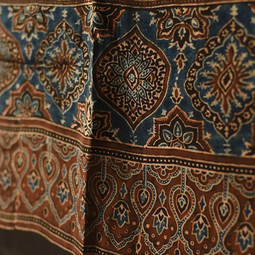 chocolate brown indigo blue ajrakh modal silk dupatta hand block printed jhar floral sprig jaal body ornate circular medallion pallu traditional mihrab arched detail wedding festive wear sustainable luxury natural dyed with tassels