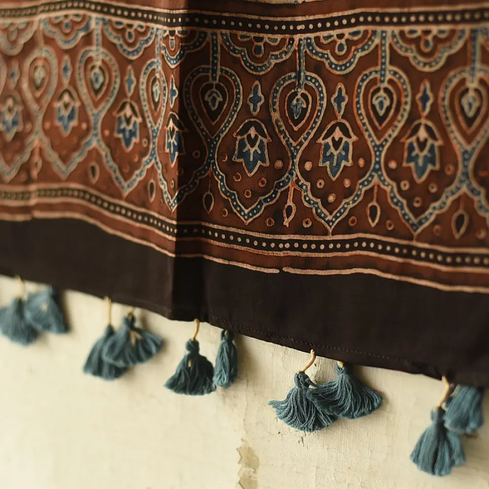 chocolate brown indigo blue ajrakh modal silk dupatta hand block printed jhar floral sprig jaal body ornate circular medallion pallu traditional mihrab arched detail wedding festive wear sustainable luxury natural dyed with tassels