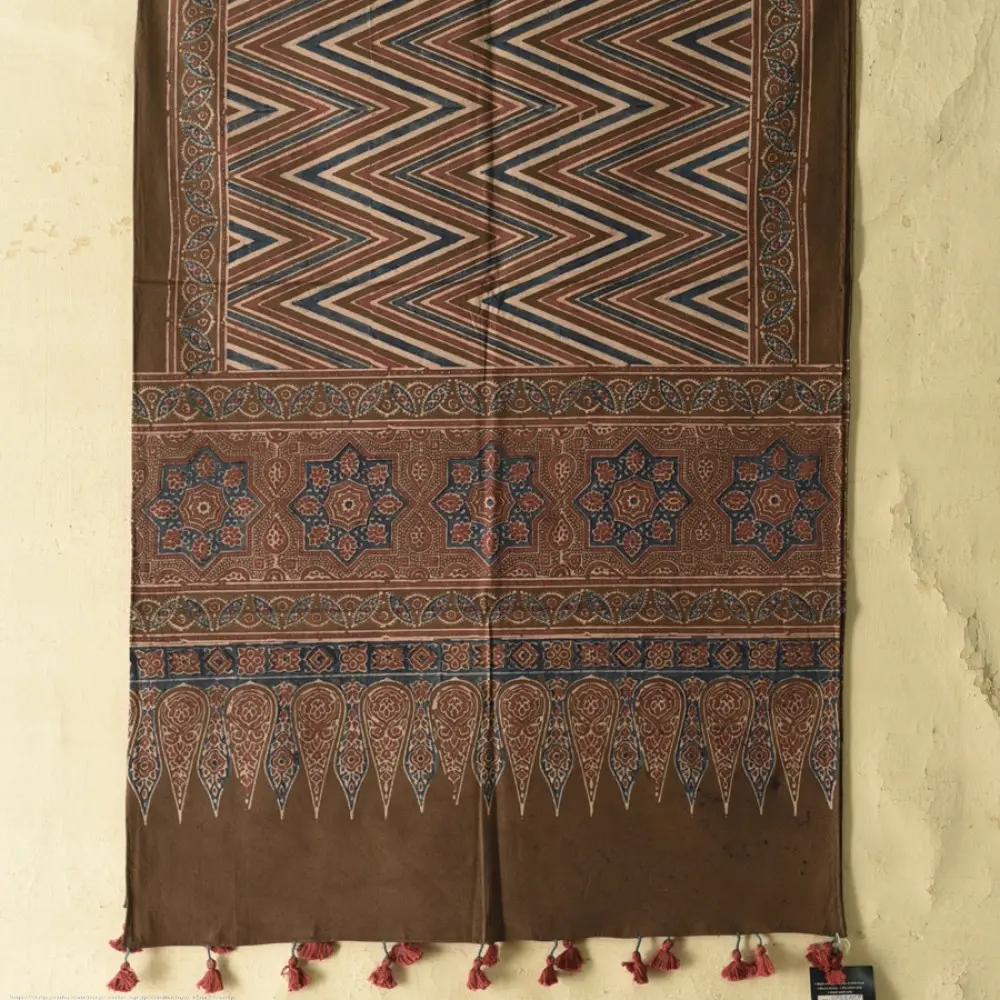 chocolate brown indigo blue madder red ajrakh cotton stole hand block printed zigzag leheriya body ornate eight-pointed star motif border traditional mihrab arched detail artisanal scarf sustainable fashion natural dyed with tassels