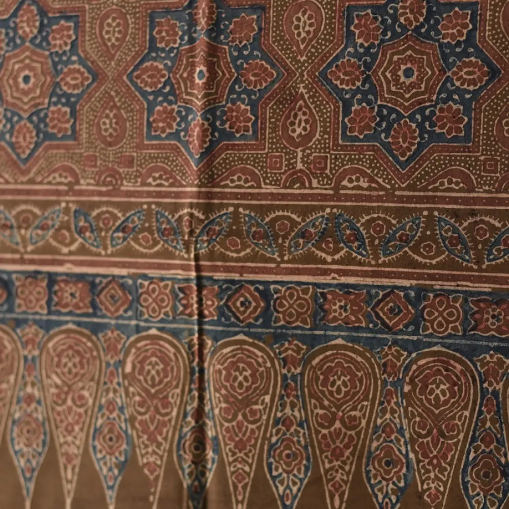 chocolate brown indigo blue madder red ajrakh cotton stole hand block printed zigzag leheriya body ornate eight-pointed star motif border traditional mihrab arched detail artisanal scarf sustainable fashion natural dyed with tassels