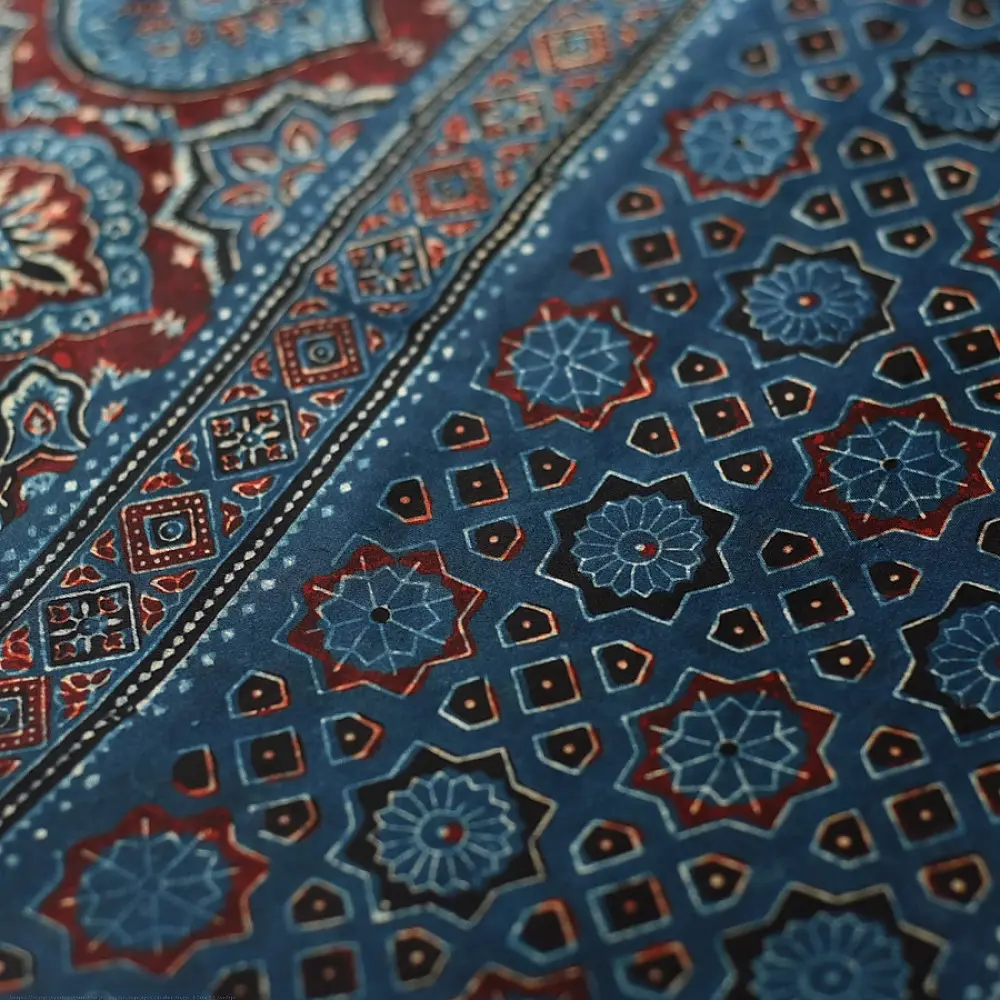 deep indigo blue ajrakh modal silk saree hand block printed minimal bundi tiny dot body ornate floral mandala pallu traditional ethnic wear sustainable luxury natural dyed