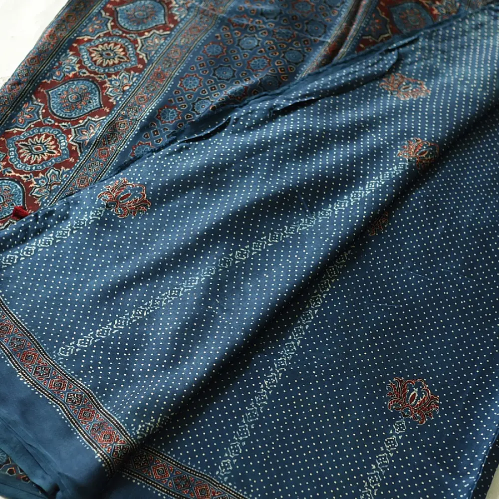 deep indigo blue ajrakh modal silk saree hand block printed minimal bundi tiny dot body ornate floral mandala pallu traditional ethnic wear sustainable luxury natural dyed