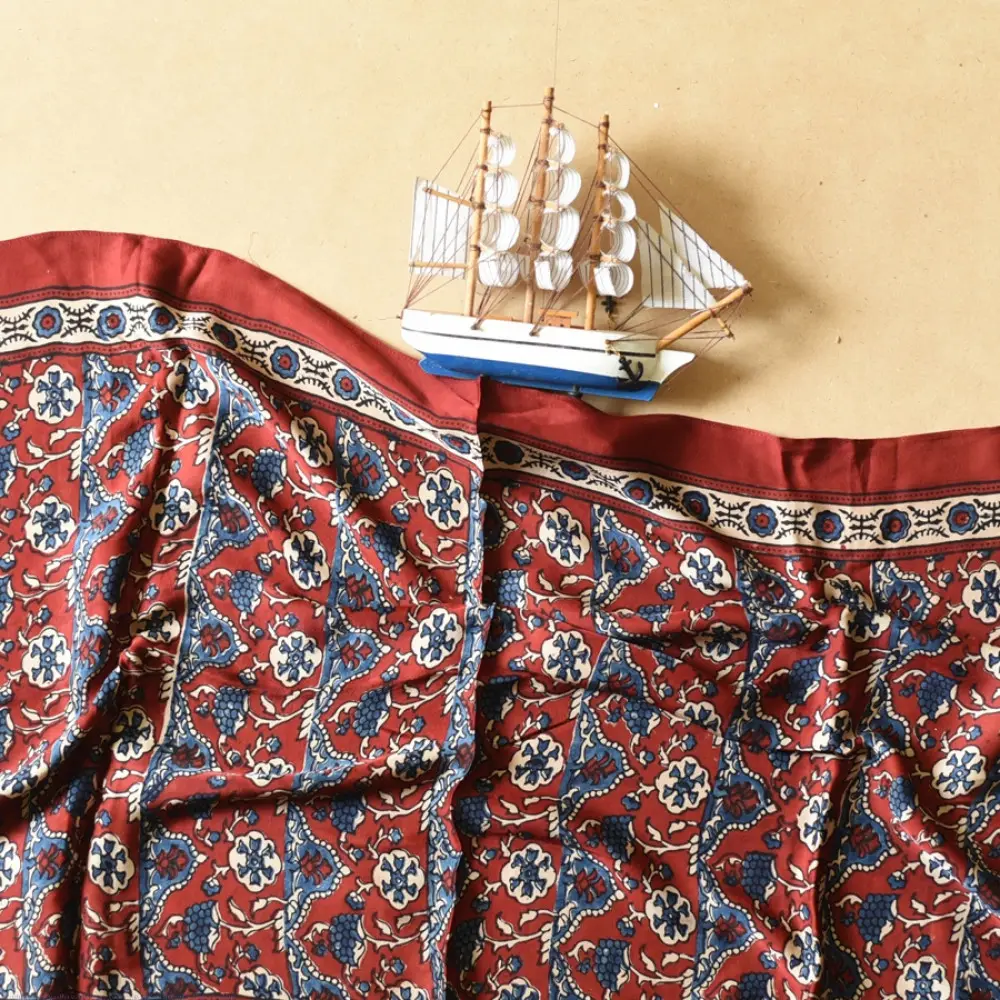 madder red indigo blue ajrakh modal silk dupatta hand block printed floral vine jaal body ornate zigzag leheriya pallu traditional mihrab arched detail wedding festive wear sustainable luxury natural dyed with tassels