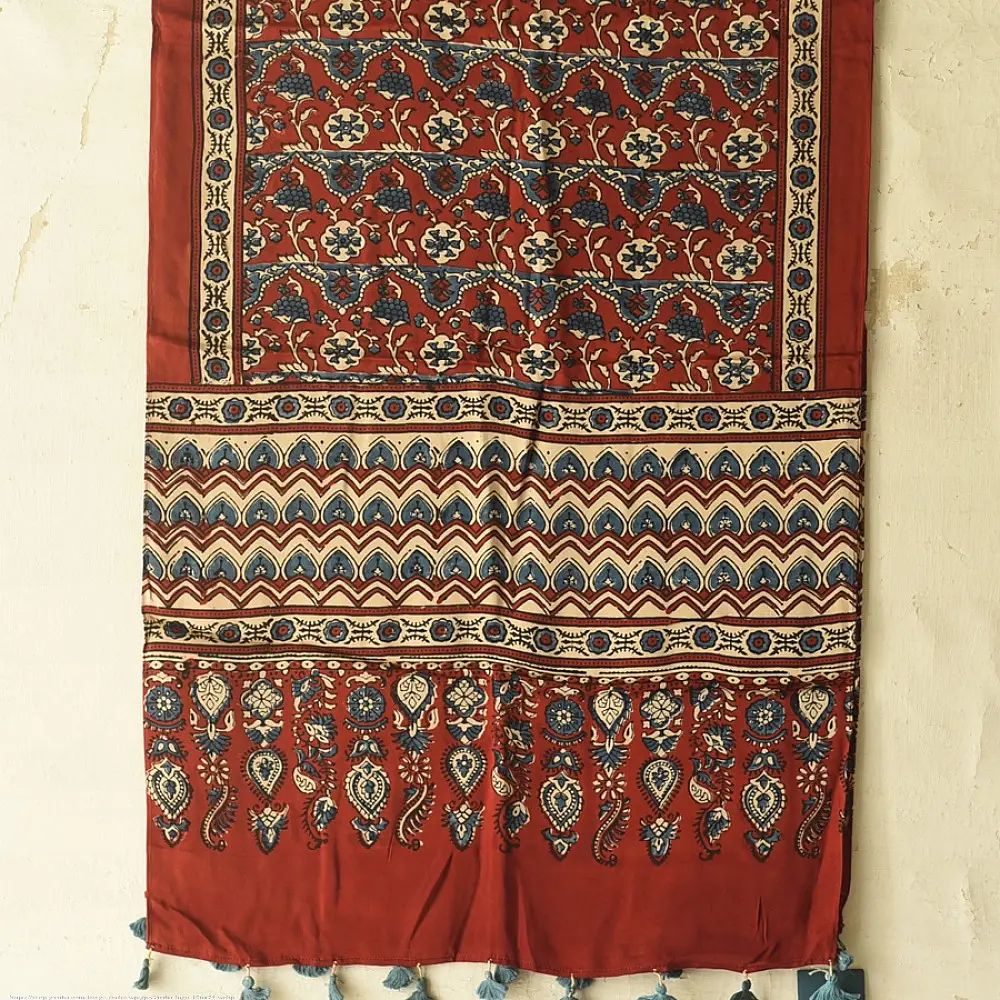 madder red indigo blue ajrakh modal silk dupatta hand block printed floral vine jaal body ornate zigzag leheriya pallu traditional mihrab arched detail wedding festive wear sustainable luxury natural dyed with tassels