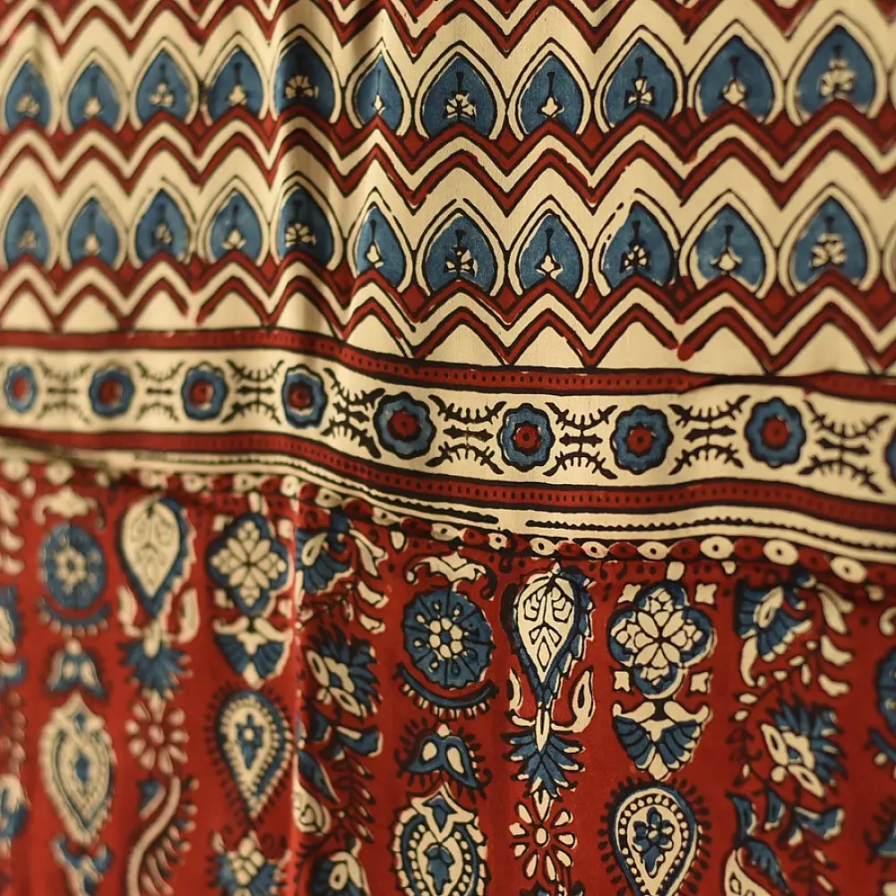 madder red indigo blue ajrakh modal silk dupatta hand block printed floral vine jaal body ornate zigzag leheriya pallu traditional mihrab arched detail wedding festive wear sustainable luxury natural dyed with tassels