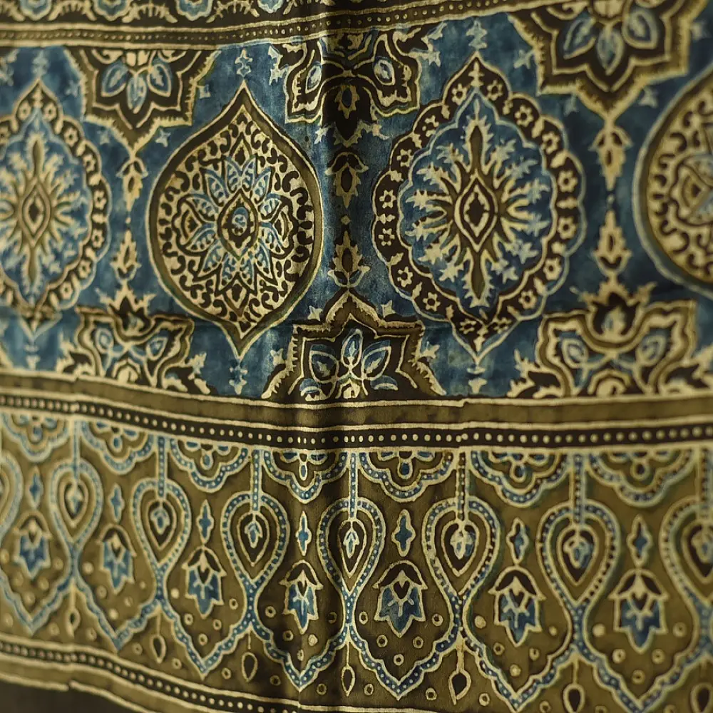 chocolate brown indigo blue ajrakh modal silk dupatta hand block printed floral vine jaal body ornate circular medallion pallu traditional mihrab arched detail wedding festive wear sustainable luxury natural dyed with tassels