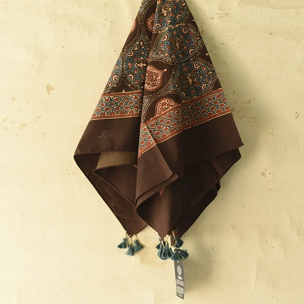 Square Ajrakh cotton scarf featuring hand-block printed teardrop motifs in natural indigo and madder red on a deep brown base.