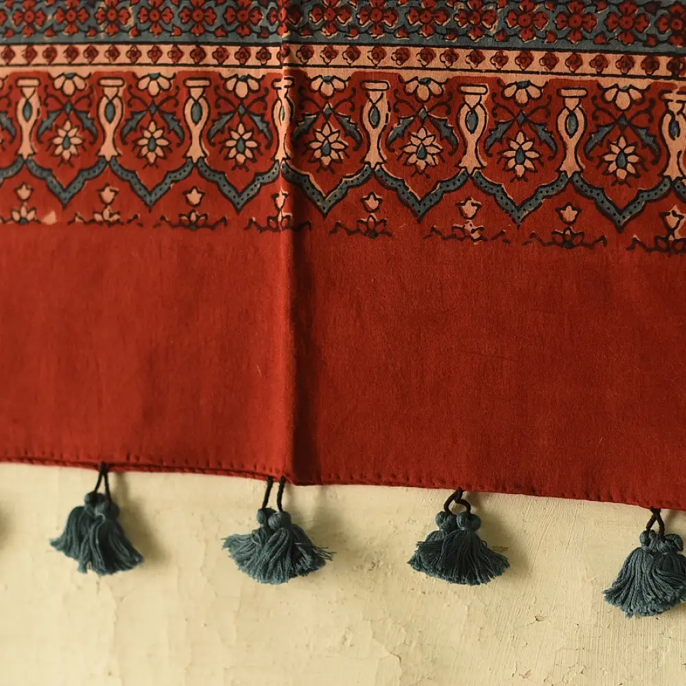 terracotta madder red ajrakh cotton stole hand block printed large circular chand moon medallion geometric lattice body ornate floral mihrab border traditional artisanal scarf sustainable fashion natural dyed with tassels