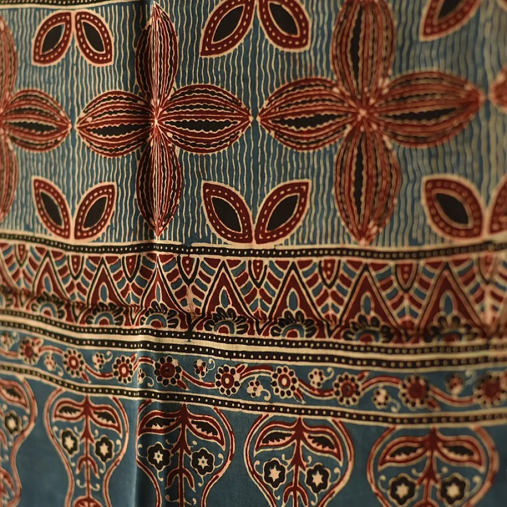 deep indigo blue madder red ajrakh modal silk dupatta hand block printed patchwork body chand moon medallion motifs ornate petal pallu traditional mihrab arched detail wedding festive wear sustainable luxury natural dyed with tassels