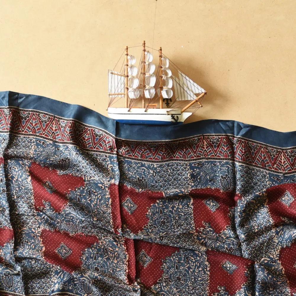 deep indigo blue madder red ajrakh modal silk dupatta hand block printed patchwork body chand moon medallion motifs ornate petal pallu traditional mihrab arched detail wedding festive wear sustainable luxury natural dyed with tassels