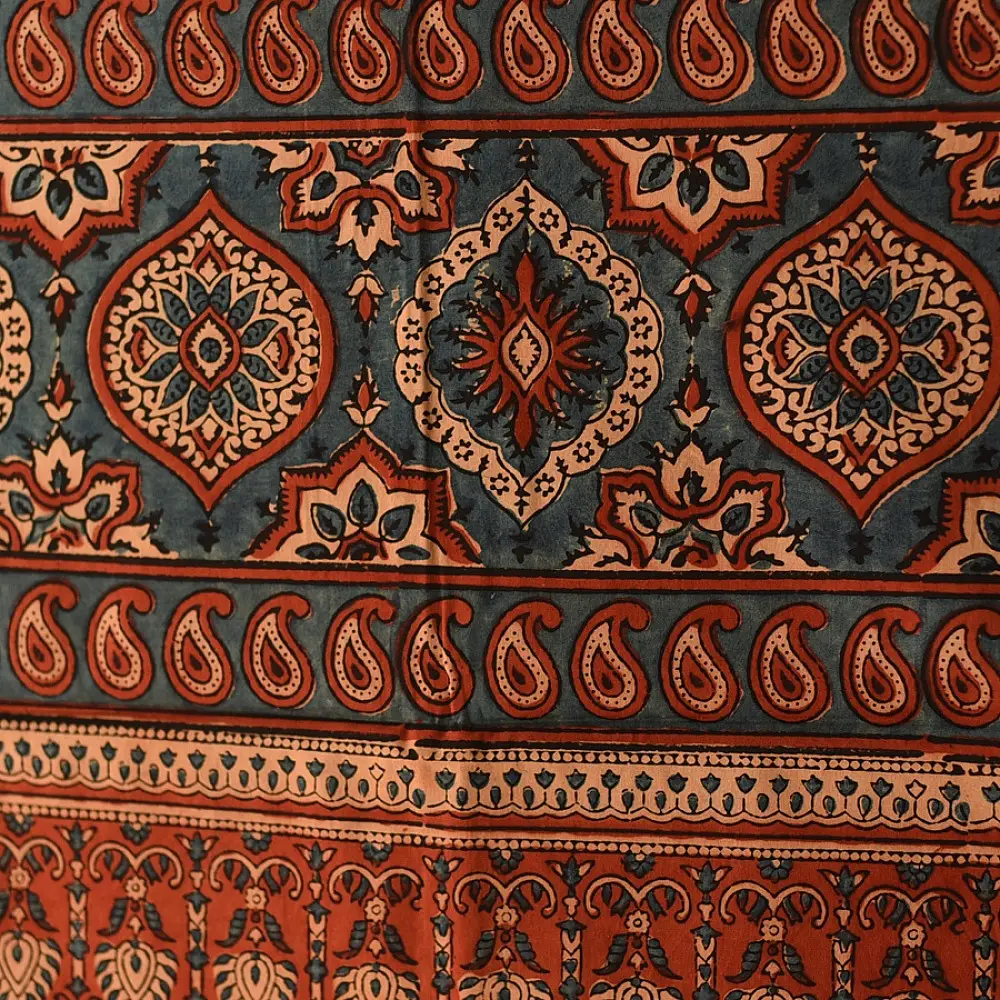 madder red indigo blue ajrakh cotton stole hand block printed floral medallion jaal body traditional paisley kalka border ornate mihrab arched detail artisanal scarf sustainable fashion natural dyed with tassels
