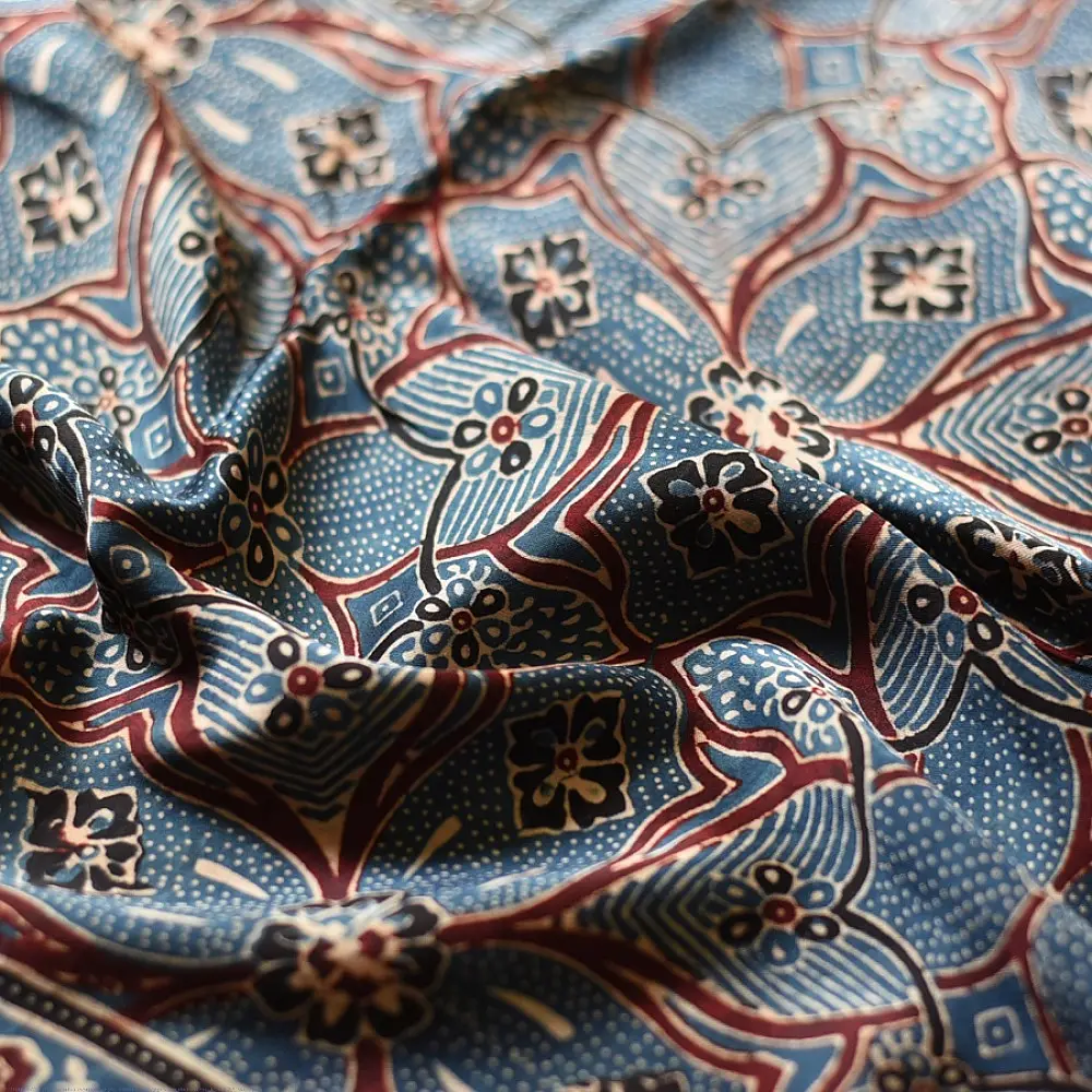 deep indigo blue madder red ajrakh modal silk dupatta hand block printed floral medallion jaal body ornate cross-lattice pallu traditional mihrab arched detail wedding festive wear sustainable luxury natural dyed with tassels