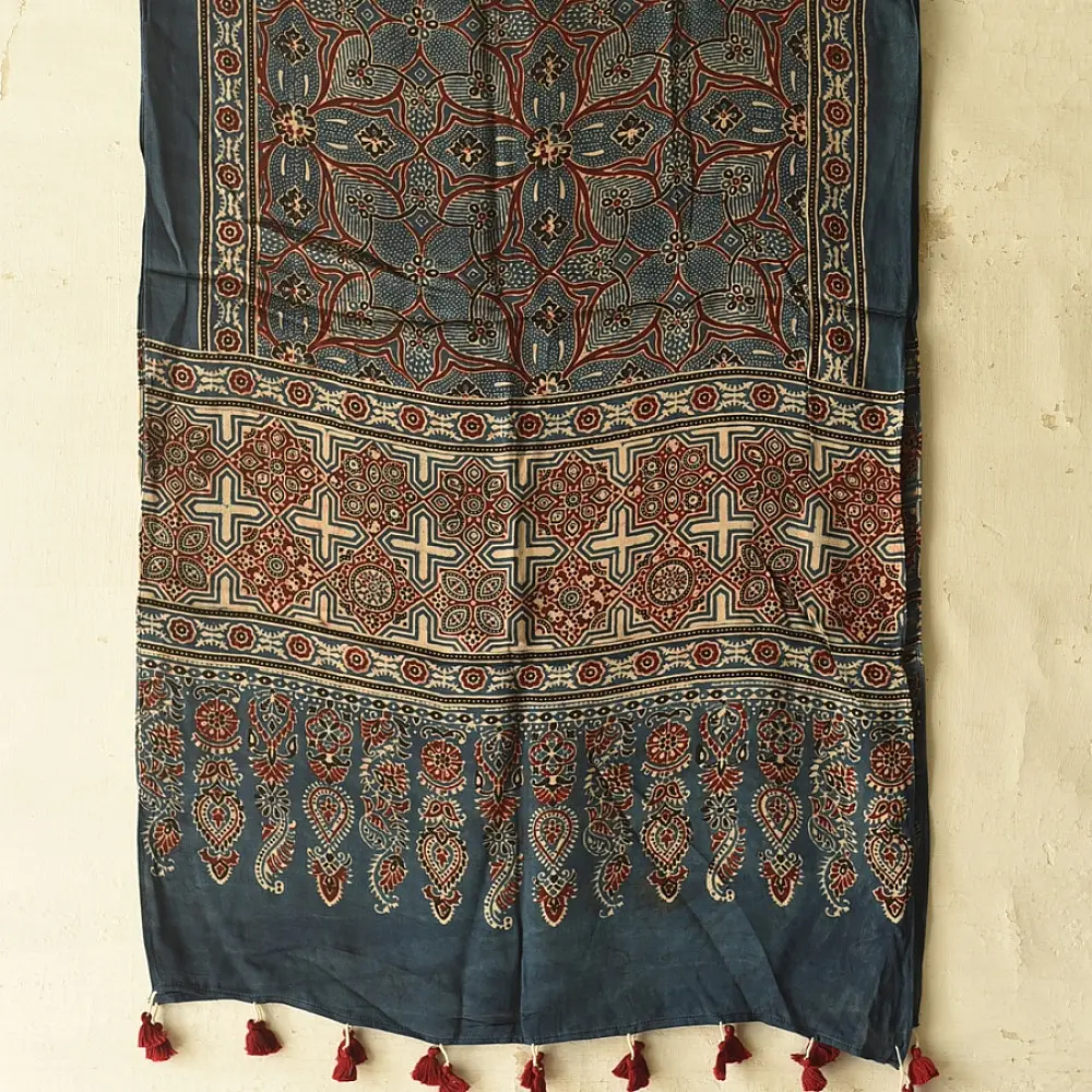 deep indigo blue madder red ajrakh modal silk dupatta hand block printed floral medallion jaal body ornate cross-lattice pallu traditional mihrab arched detail wedding festive wear sustainable luxury natural dyed with tassels