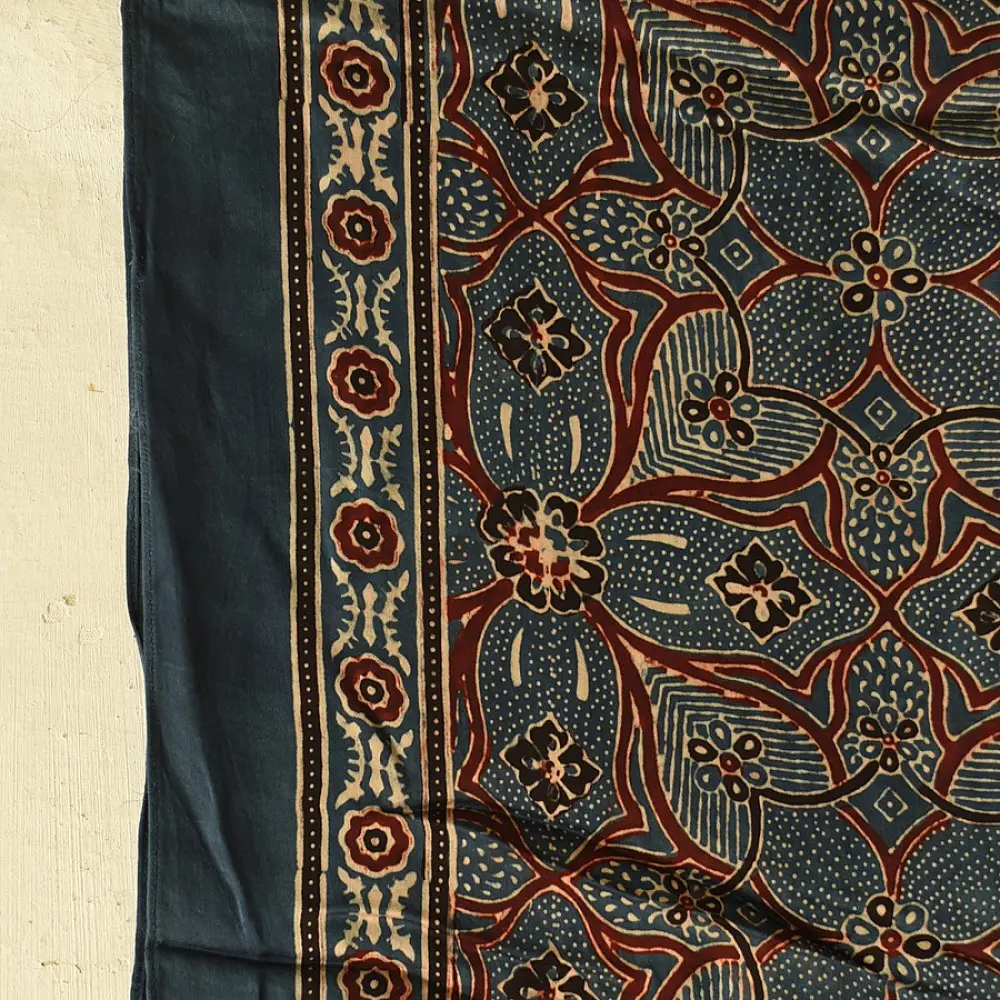 deep indigo blue madder red ajrakh modal silk dupatta hand block printed floral medallion jaal body ornate cross-lattice pallu traditional mihrab arched detail wedding festive wear sustainable luxury natural dyed with tassels