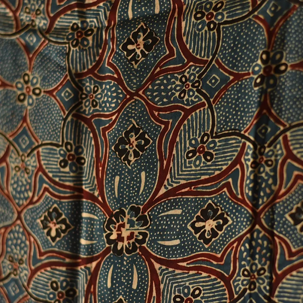 deep indigo blue madder red ajrakh modal silk dupatta hand block printed floral medallion jaal body ornate cross-lattice pallu traditional mihrab arched detail wedding festive wear sustainable luxury natural dyed with tassels