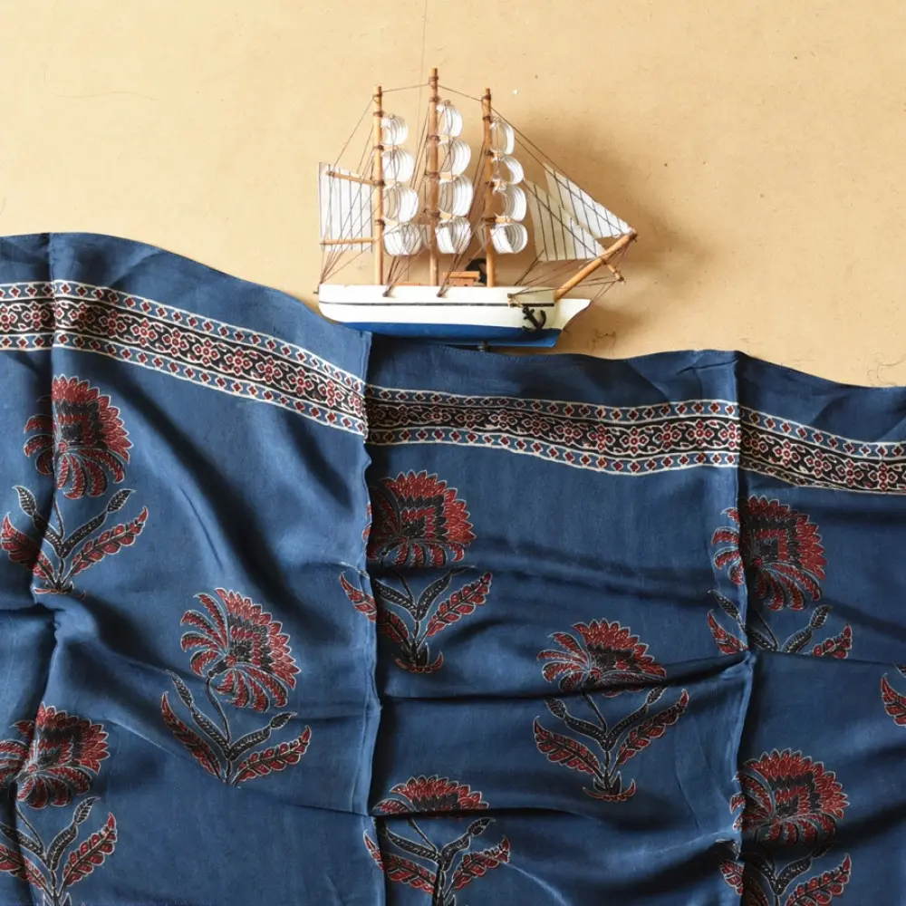 deep indigo blue madder red ajrakh silk stole hand block printed floral buta motif body ornate star medallion border traditional mihrab arched detail artisanal scarf sustainable fashion natural dyed with tassels