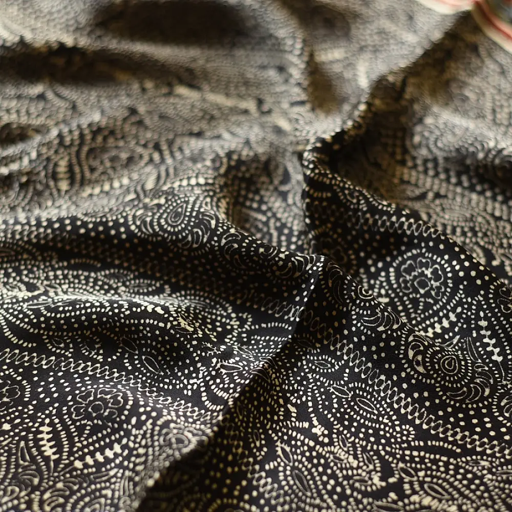 black gold ajrakh cotton stole hand block printed bundi tiny dot body ornate circular mandala border traditional mihrab arched detail artisanal scarf sustainable fashion natural dyed with tassels