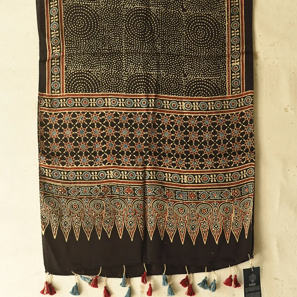 black gold ajrakh modal silk dupatta hand block printed large chand moon medallion bundi dot jaal body ornate eight-pointed star pallu traditional mihrab arched detail wedding festive wear sustainable luxury natural dyed with tassels
