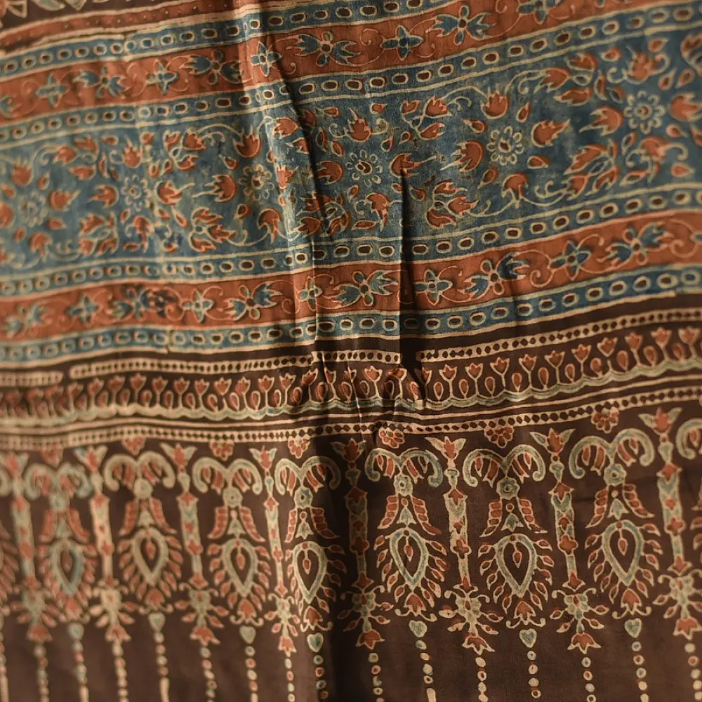 chocolate brown indigo madder red ajrakh modal silk dupatta hand block printed floral vine jaal body ornate geometric lozenge pallu traditional mihrab arched detail wedding festive wear sustainable luxury natural dyed with tassels