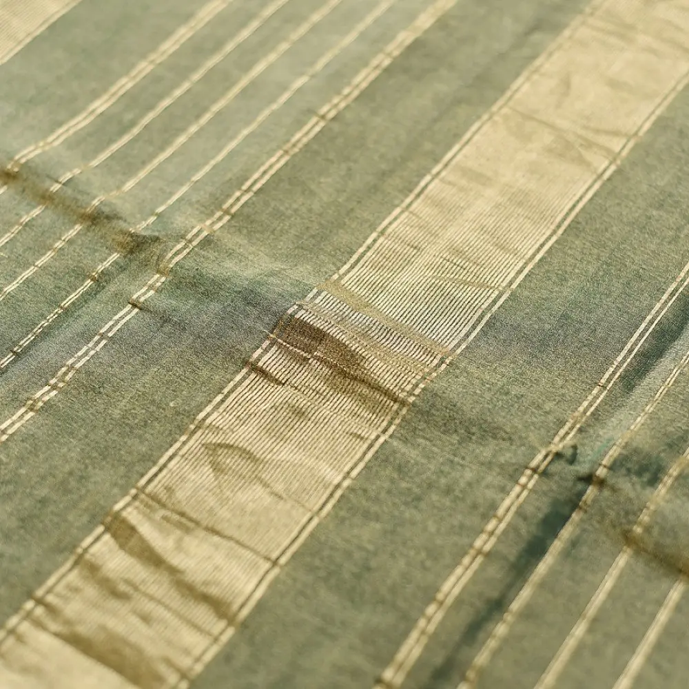 sage green handloom maheshwari tissue silk cotton saree with broad golden zari panels and red borders for women