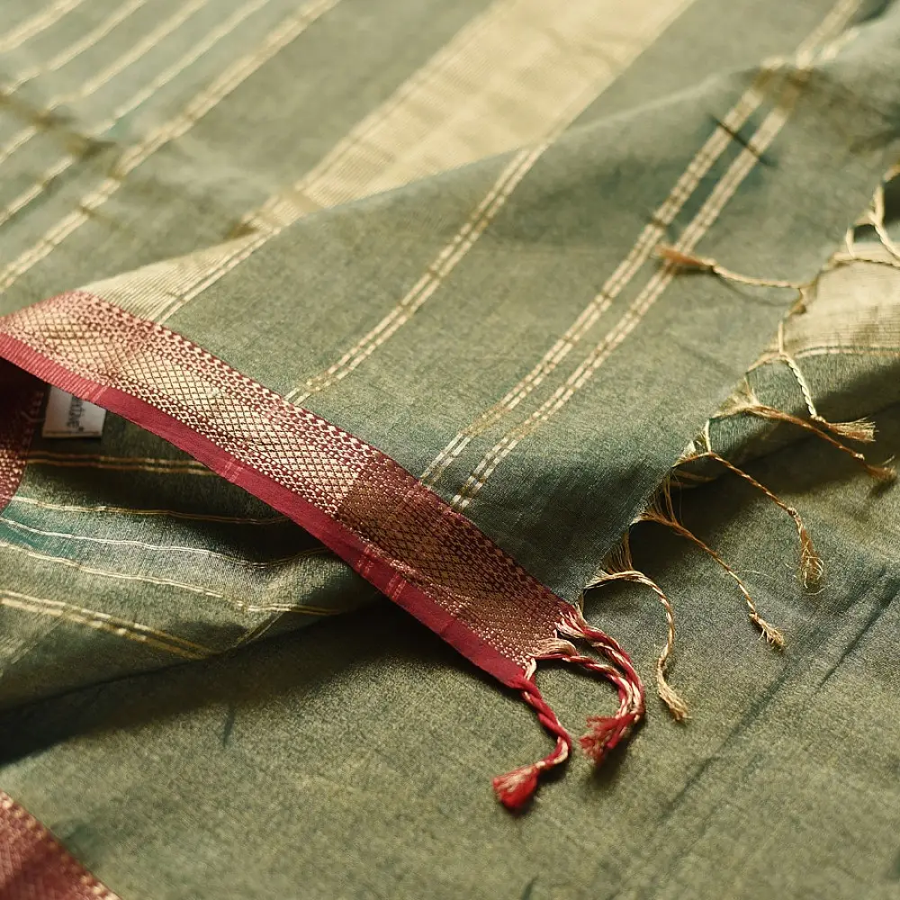 sage green handloom maheshwari tissue silk cotton saree with broad golden zari panels and red borders for women