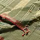sage green handloom maheshwari tissue silk cotton saree with broad golden zari panels and red borders for women
