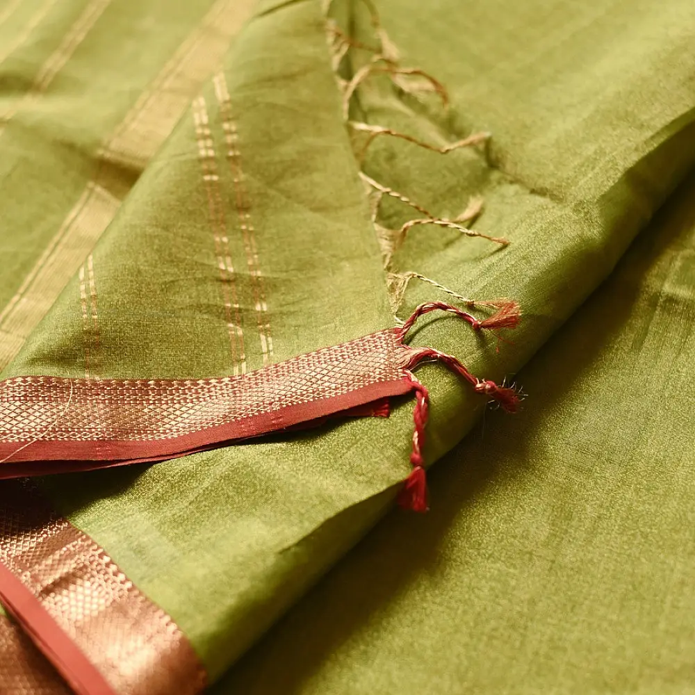 leaf green and gold handloom maheshwari tissue silk cotton saree with fine striped body and red borders for women