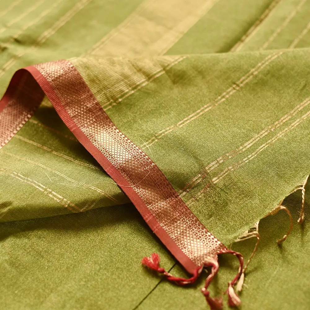 leaf green and gold handloom maheshwari tissue silk cotton saree with fine striped body and red borders for women