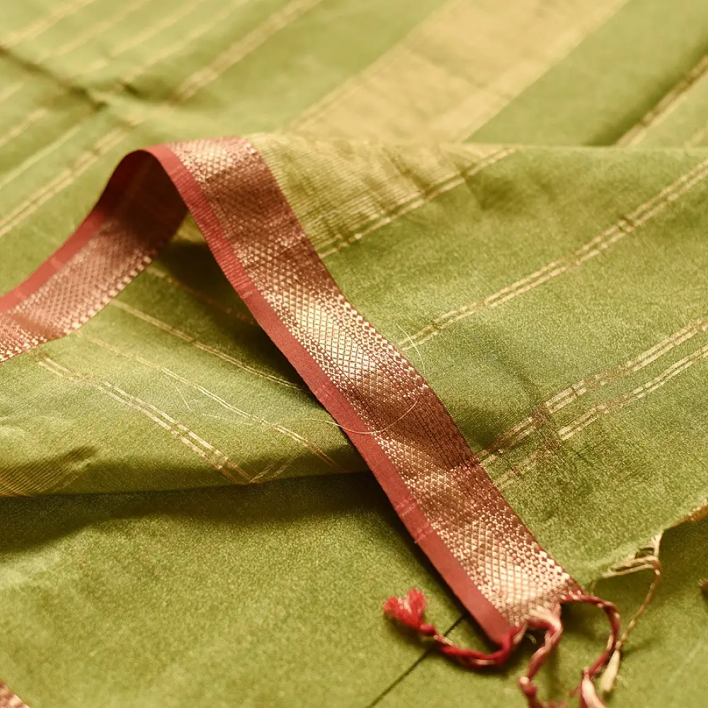 leaf green and gold handloom maheshwari tissue silk cotton saree with fine striped body and red borders for women