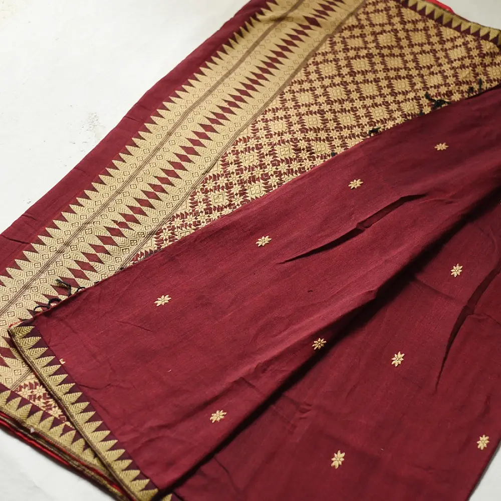 maroon red handloom traditional assam cotton saree with small gold star butta motifs and triangular border weaves for women