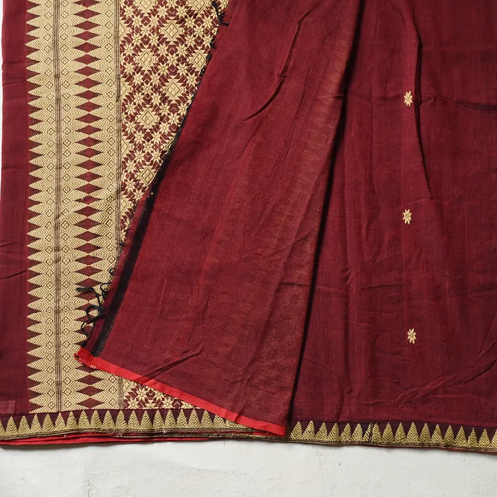 maroon red handloom traditional assam cotton saree with small gold star butta motifs and triangular border weaves for women