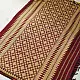maroon red handloom traditional assam cotton saree with small gold star butta motifs and triangular border weaves for women