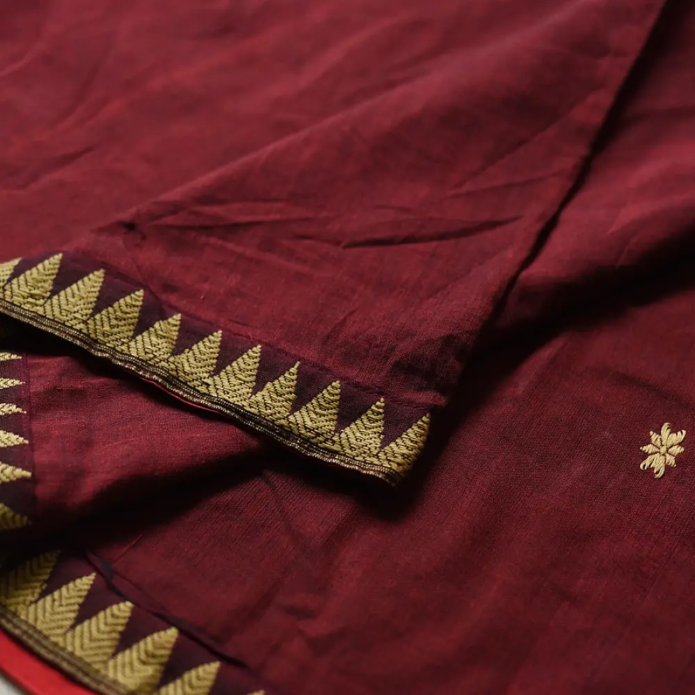maroon red handloom traditional assam cotton saree with small gold star butta motifs and triangular border weaves for women