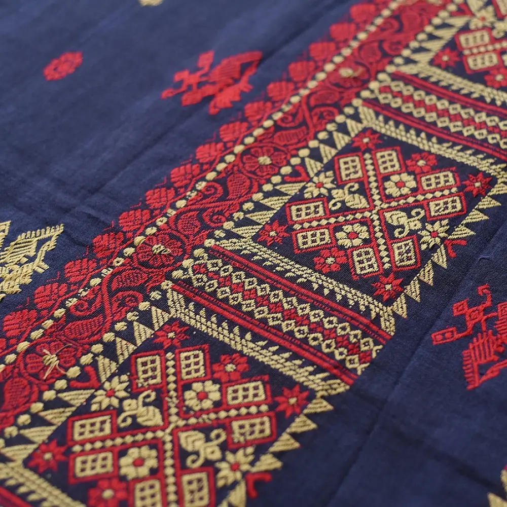 navy blue handloom traditional assam cotton saree with small red and gold butta motifs and woven red borders for women