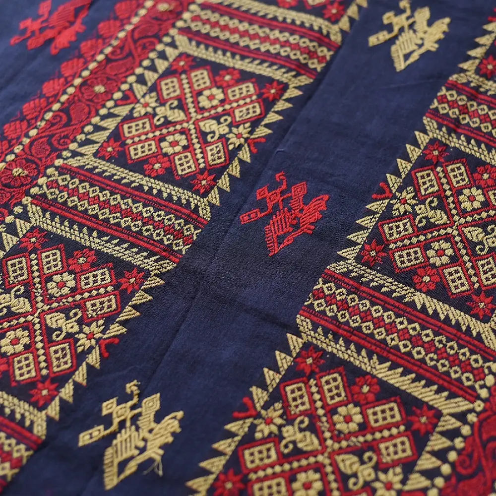 navy blue handloom traditional assam cotton saree with small red and gold butta motifs and woven red borders for women