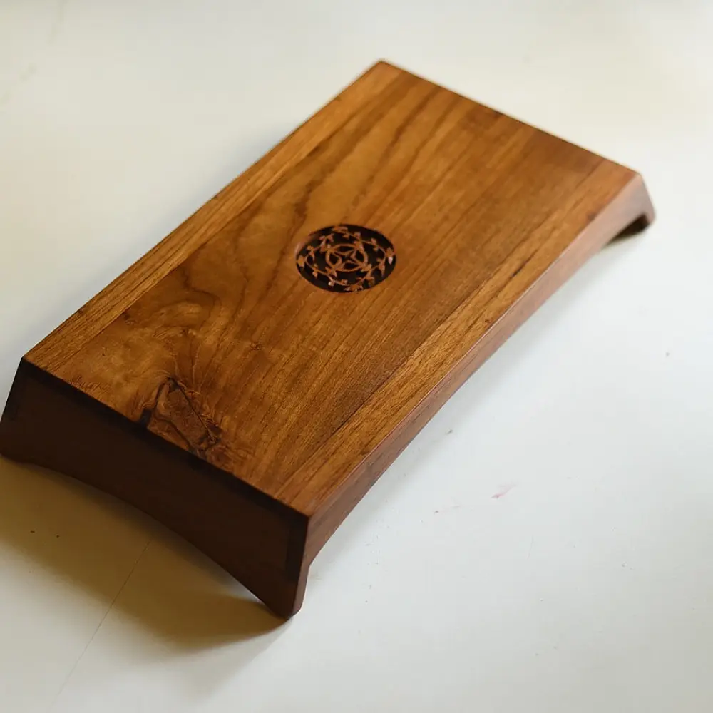 handmade wooden serving tray with carved geometric center design