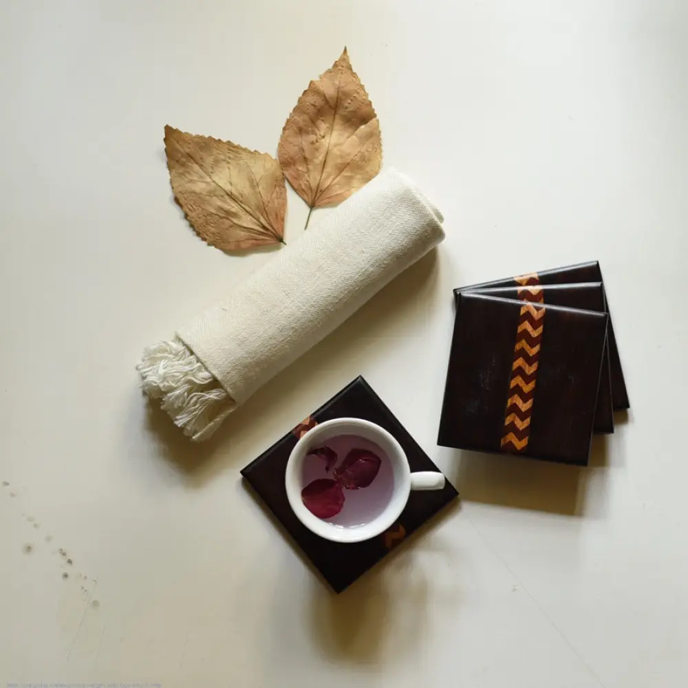 handmade dark wood coasters set of four with zigzag wooden inlay design