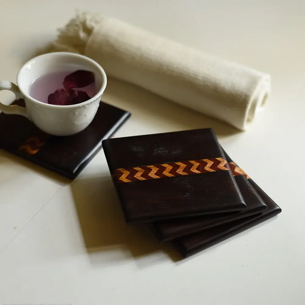 handmade dark wood coasters set of four with zigzag wooden inlay design
