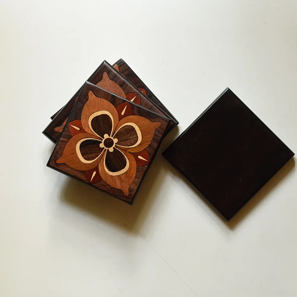 handmade dark wood coasters set of four with four petal flower wooden inlay design