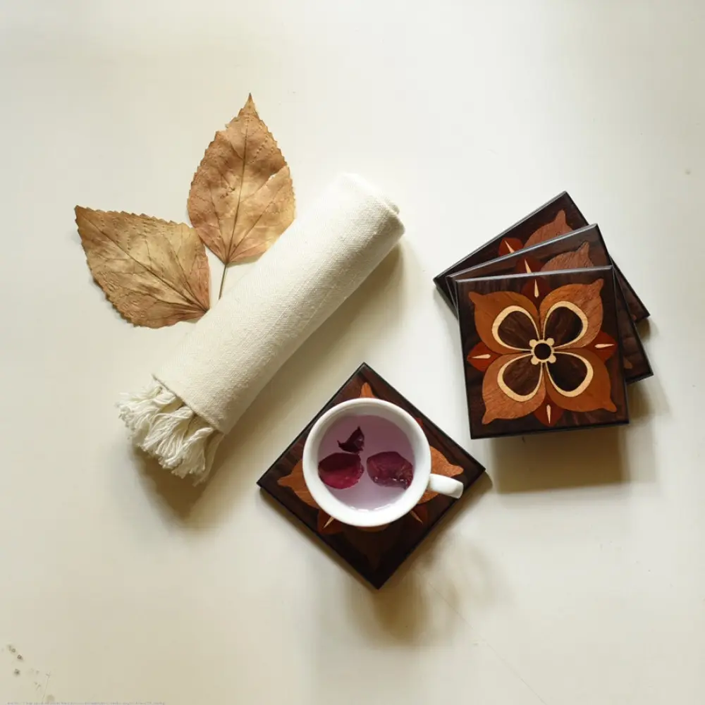 handmade dark wood coasters set of four with four petal flower wooden inlay design