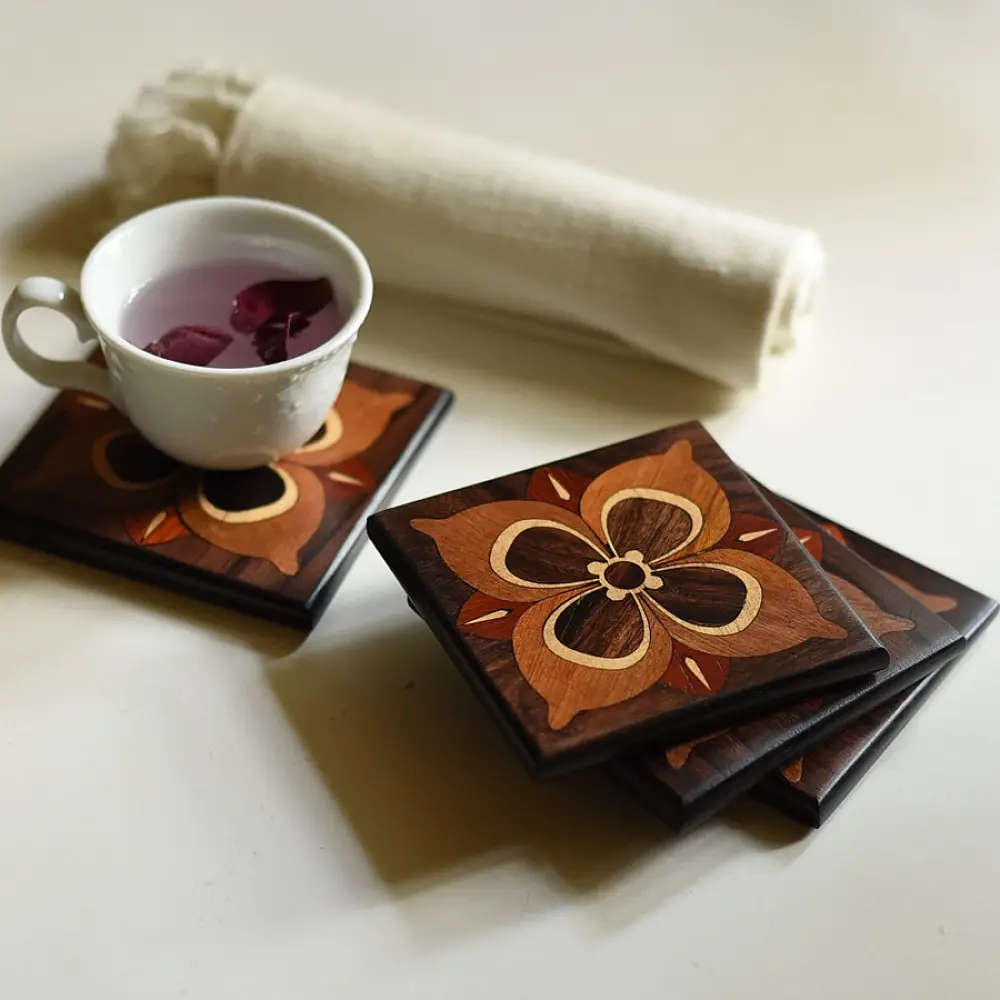 handmade dark wood coasters set of four with four petal flower wooden inlay design