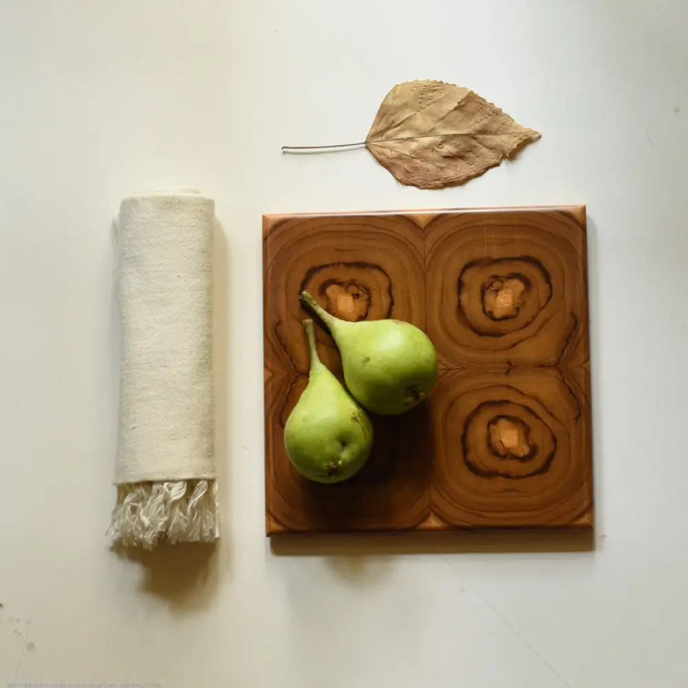 handmade wooden trivet with carved circular quadrant pattern
