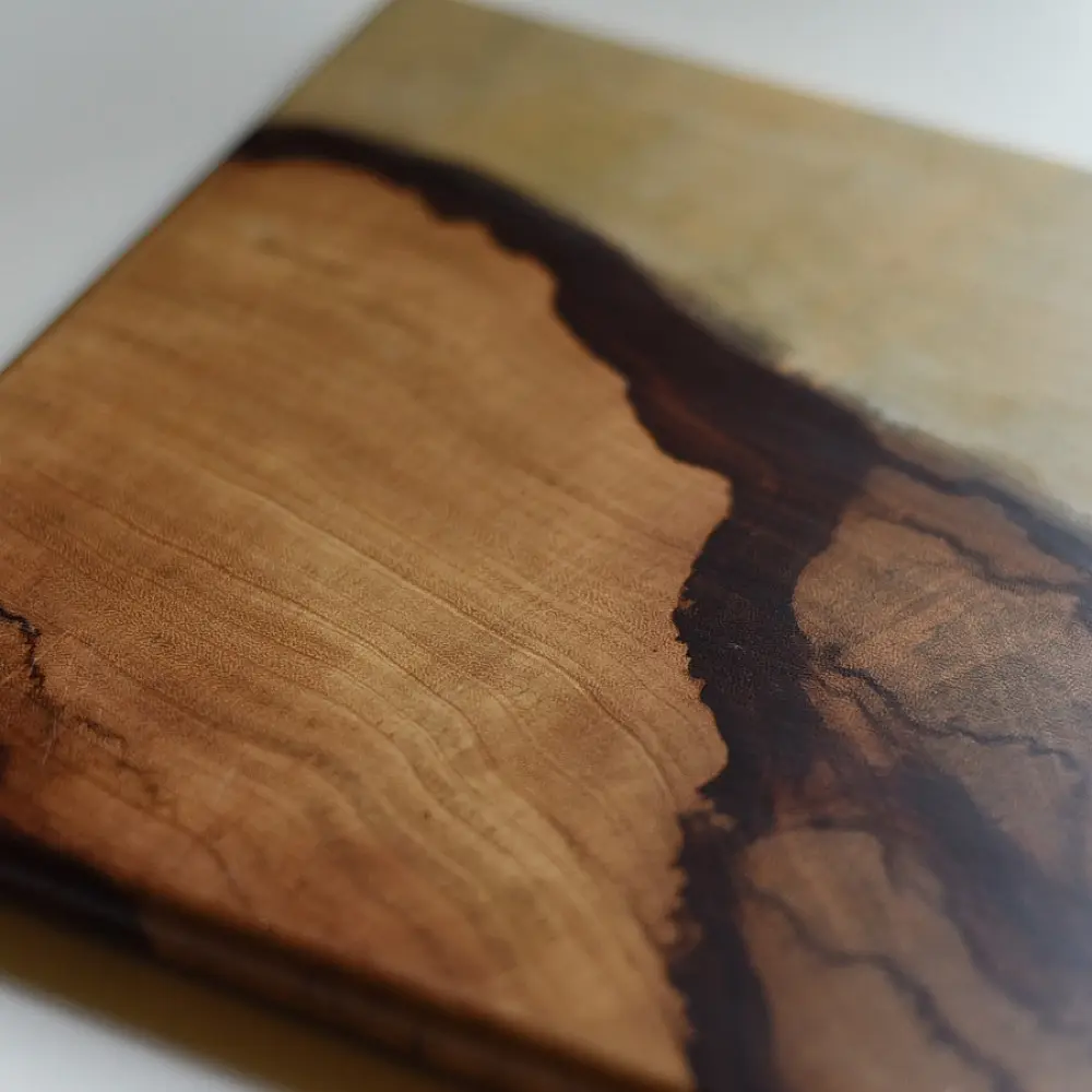 handmade wooden trivet with natural grain pattern and epoxy inlay