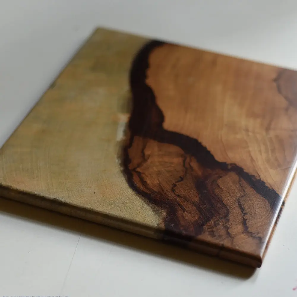 handmade wooden trivet with natural grain pattern and epoxy inlay