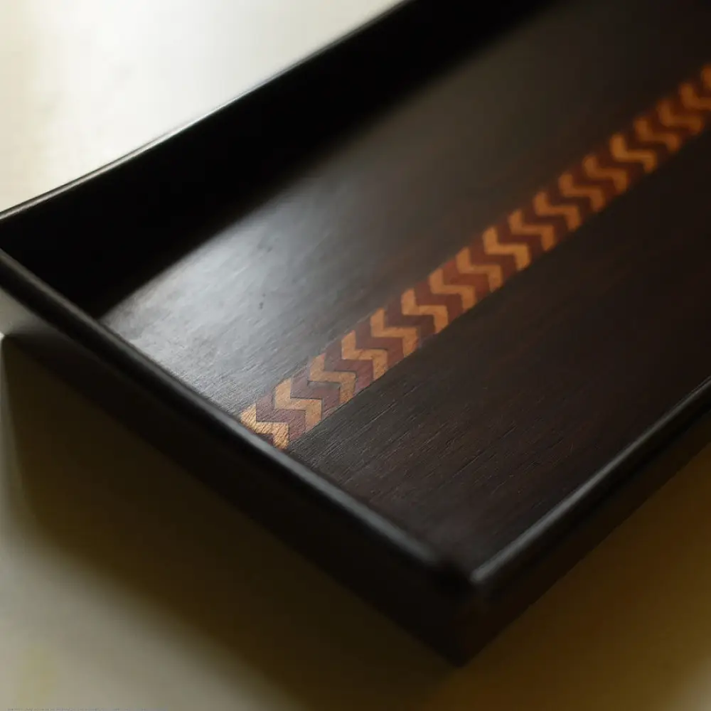 handmade wooden serving tray with zig zag inlay design and raised edges